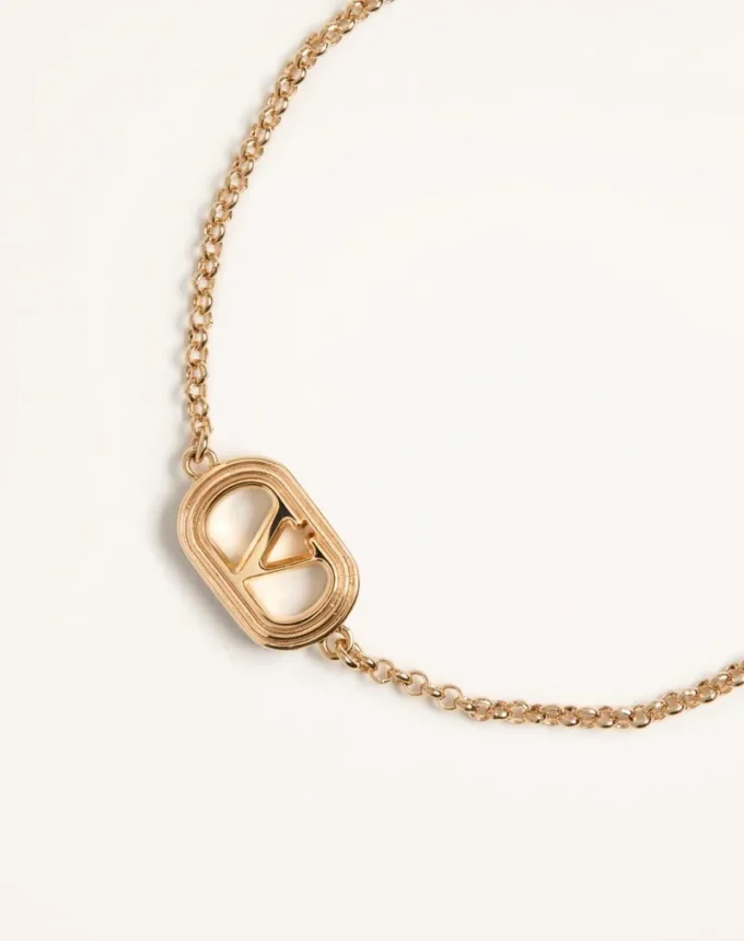 Οβάλ βραχιόλι από μέταλλο και μαργαριτάρια Swarovski® Οβάλ βραχιόλι από μέταλλο και μαργαριτάρια Swarovski®