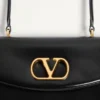 Τσάντα Valentino Garavani Vain με χερούλι από γυαλιστερό δέρμα μοσχαριού Τσάντα Valentino Garavani Vain με χερούλι από γυαλιστερό δέρμα μοσχαριού